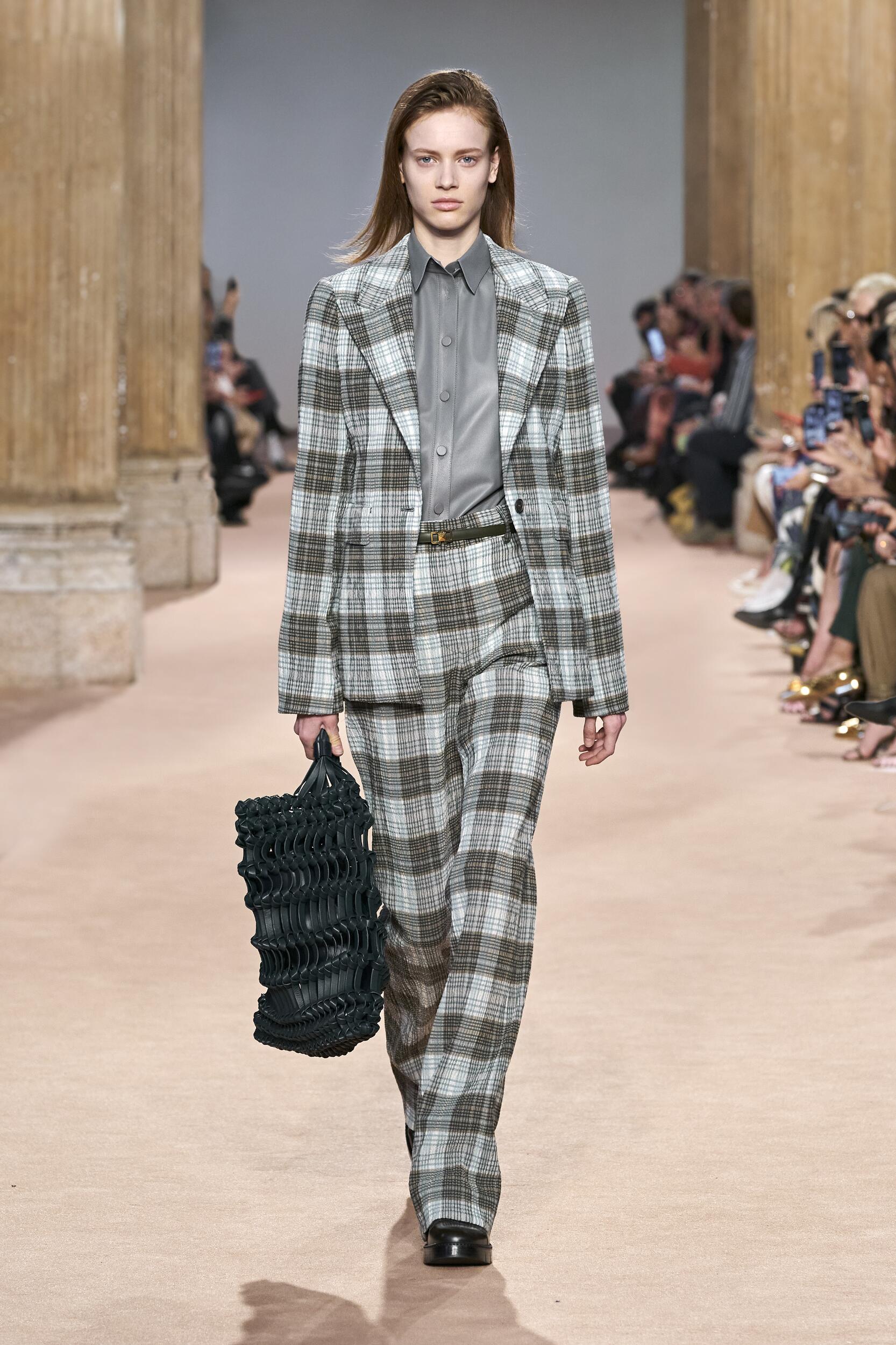 MILAN, ITALY - SEPTEMBER 22, 2018: Woman with brown Louis Vuitton checkered  bag before Salvatore Ferragamo fashion show, Milan Fashion Week street sty  Stock Photo - Alamy